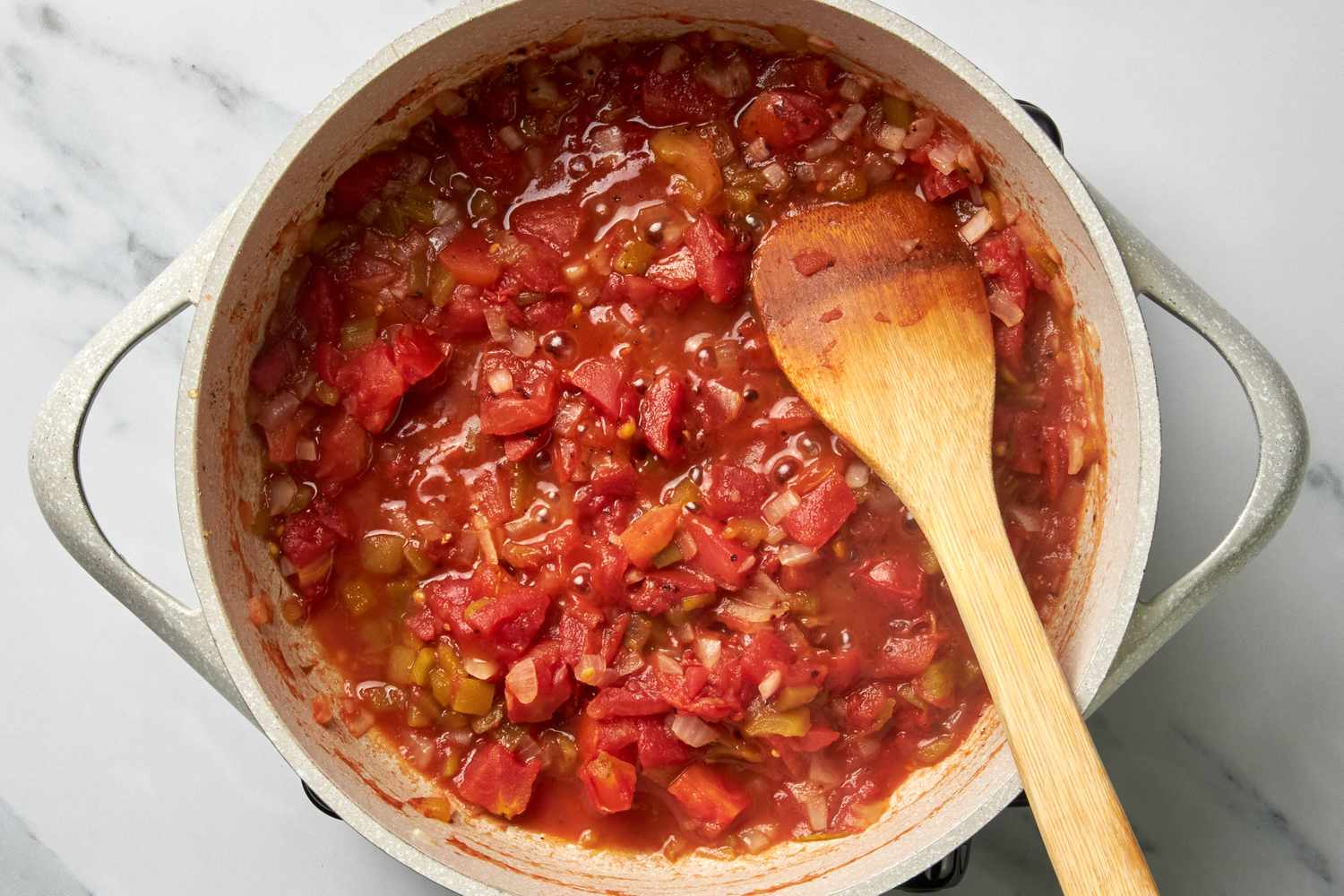 Pot of Salsa With a Wooden Spoon for Huevos Rancheros Recipe 