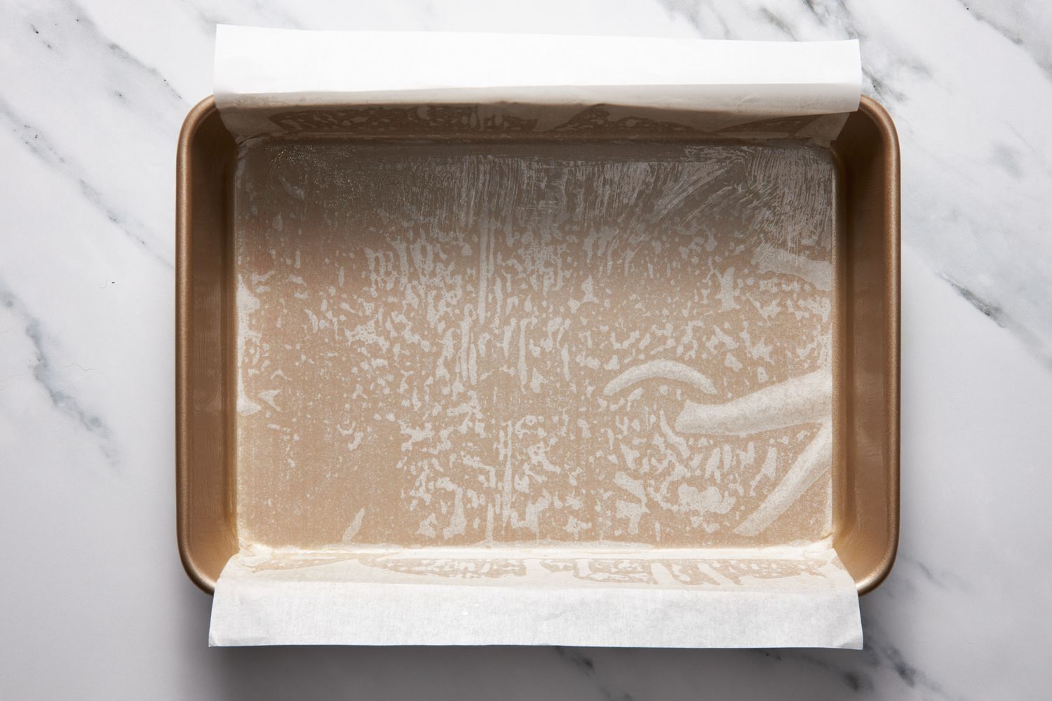 Parchment paper-lined baking pan for bumpy cake recipe