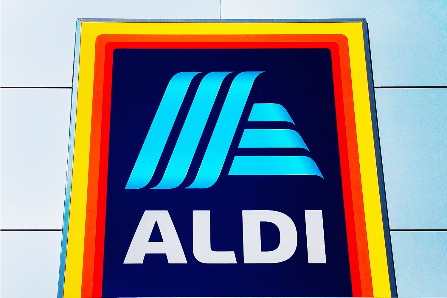 ALDI logo on a signboard, displayed prominently on a building