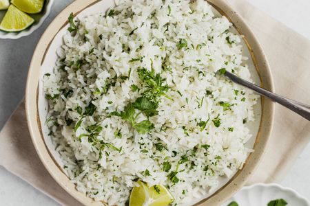 Bowl of Coconut Lime Rice with a Lime Wedge