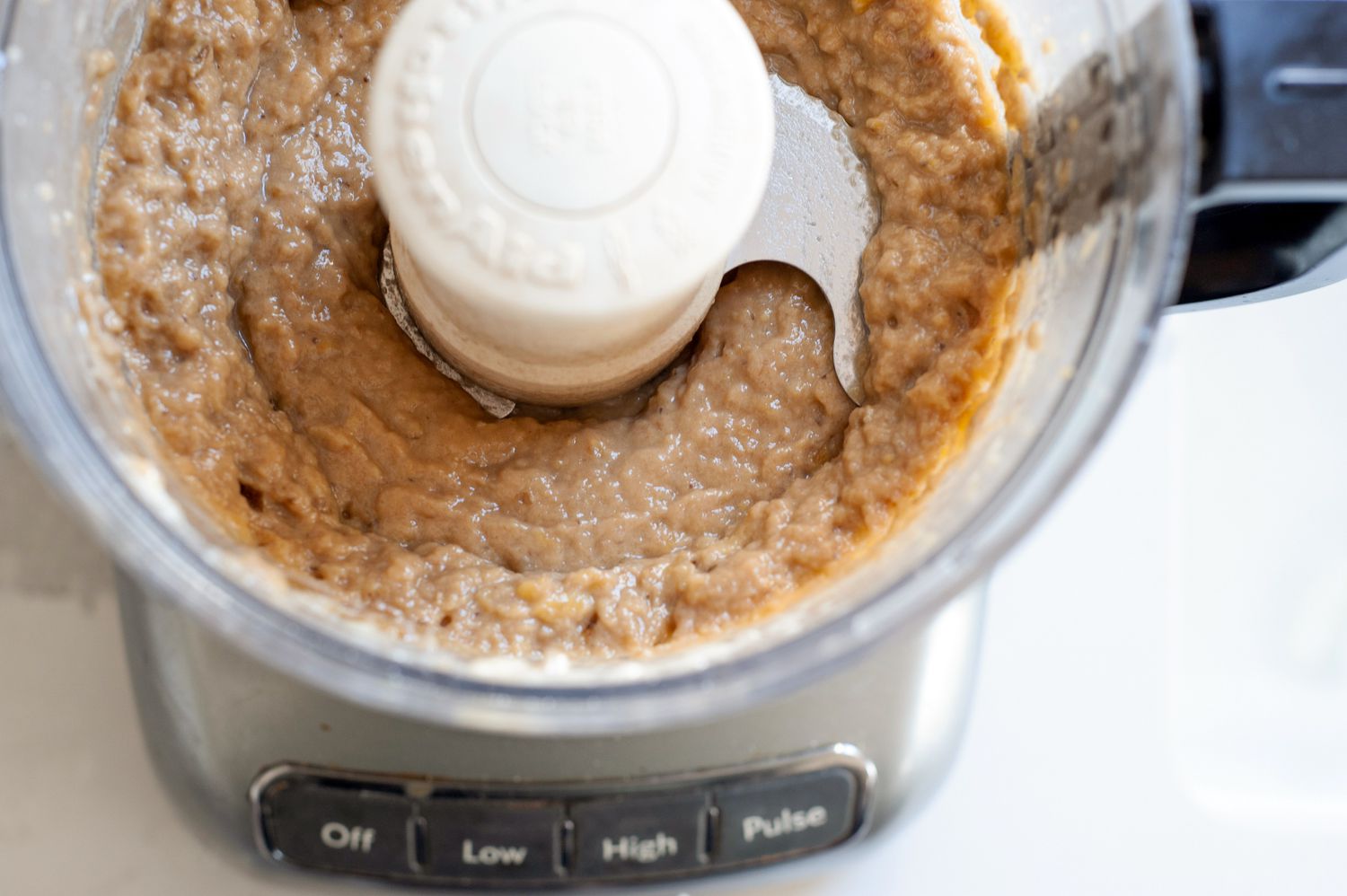 Pureed bananas in a food processor.