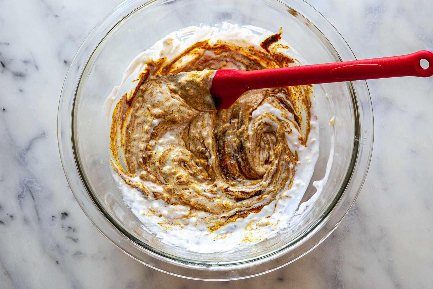 Mix Spices in Bowl with Yogurt for Grilled Tandoori Chicken