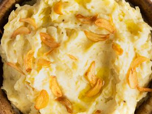 Close up of Too Much Garlic Mashed Potatoes in a brown bowl
