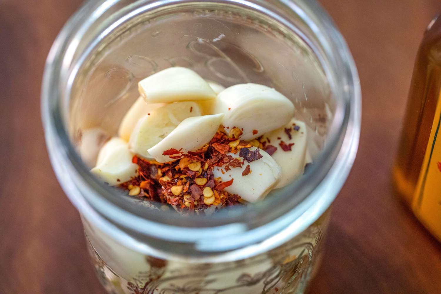 Garlic and Red Chili Flakes in a Half-Pint Jar for Fermented Garlic Honey 