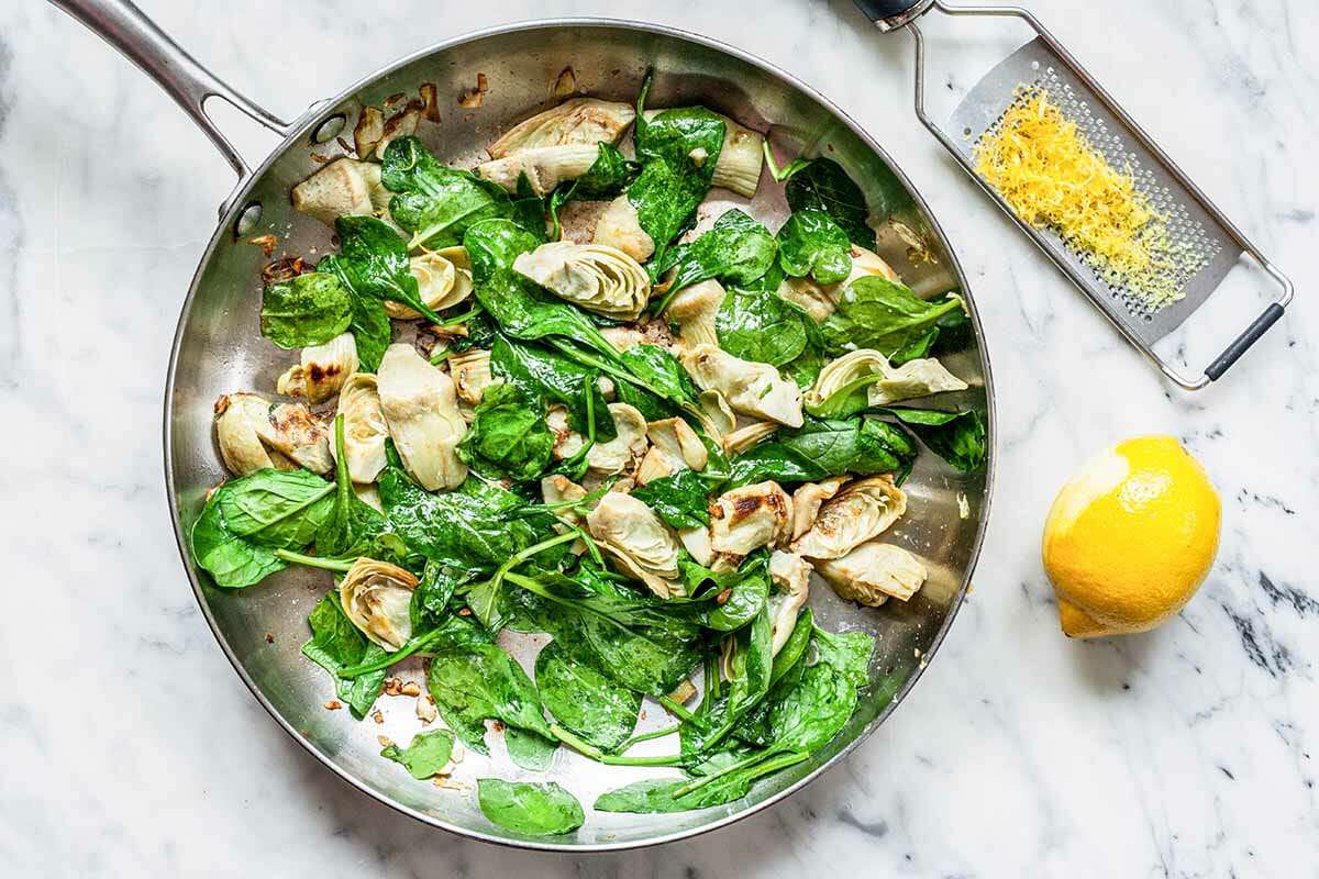 Spinach Artichoke Pasta add the spinach