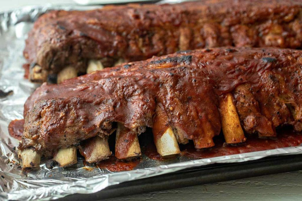 Rack of Pressure Cooker Baby Back BBQ Ribs with sauce