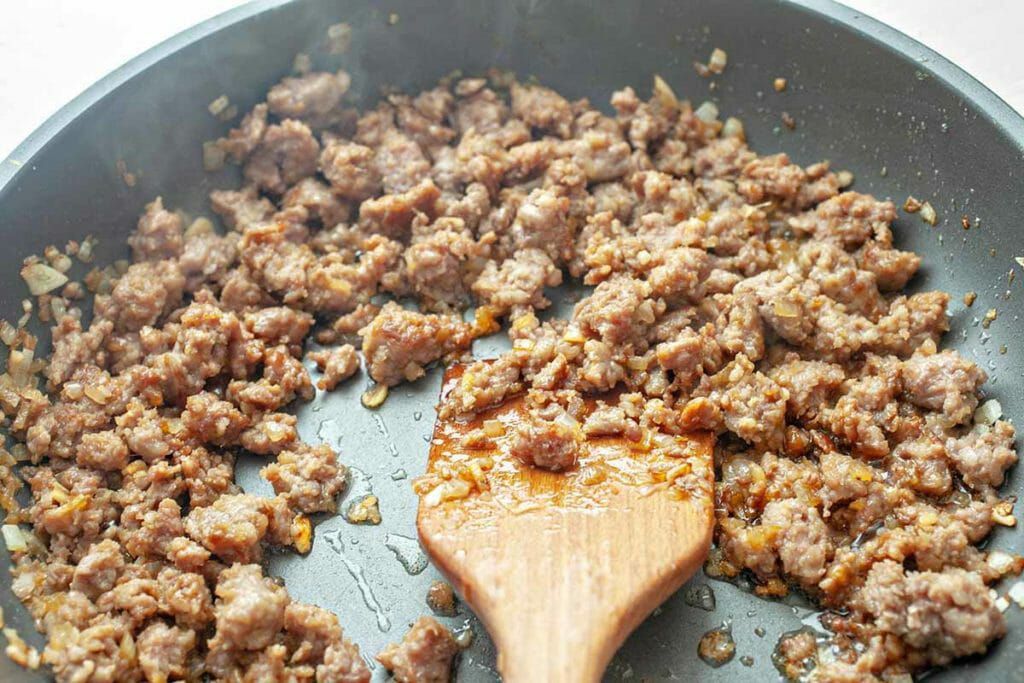 Ginger Pork Rice Bowls - browning pork in pan