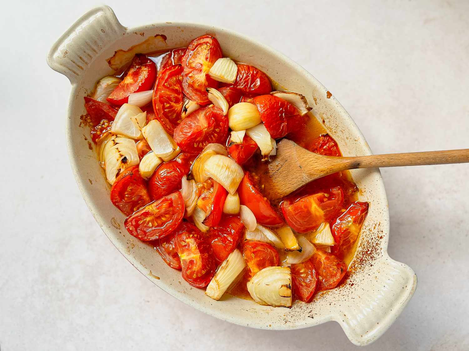 Roasted Tomatoes, Onions, and Chiles in a Casserole Dish for Pulled Pork Enchiladas
