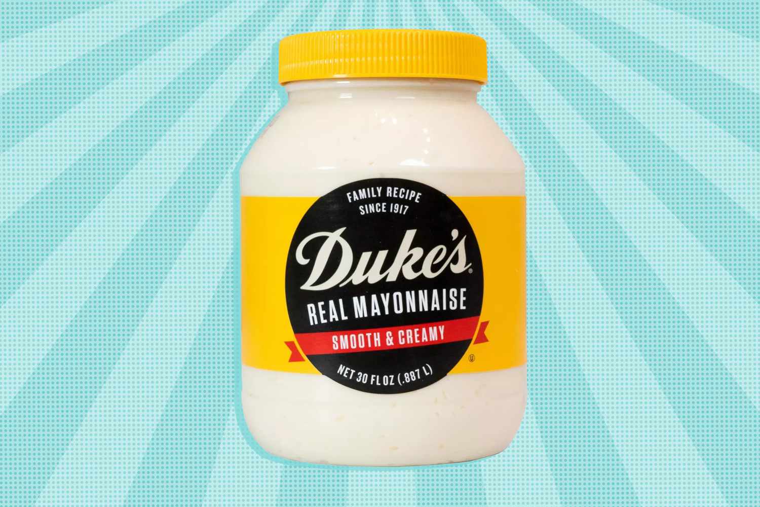 Jar of Duke's Mayonnaise over a colorful background