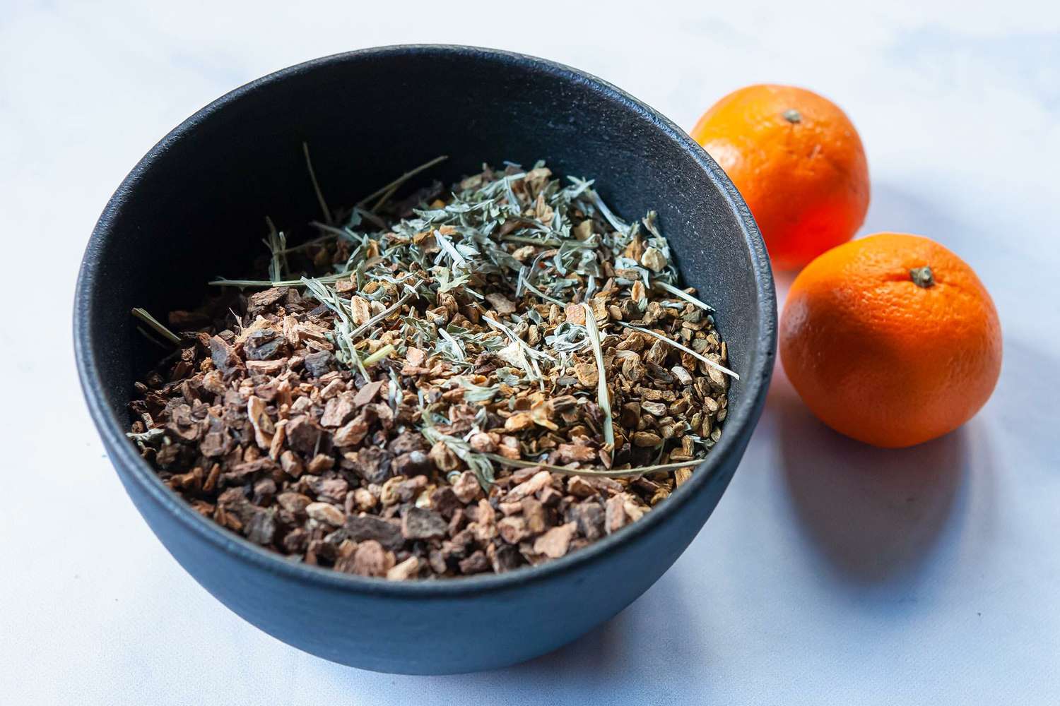A bowl with a mix of ingredients to show how to make Campari.