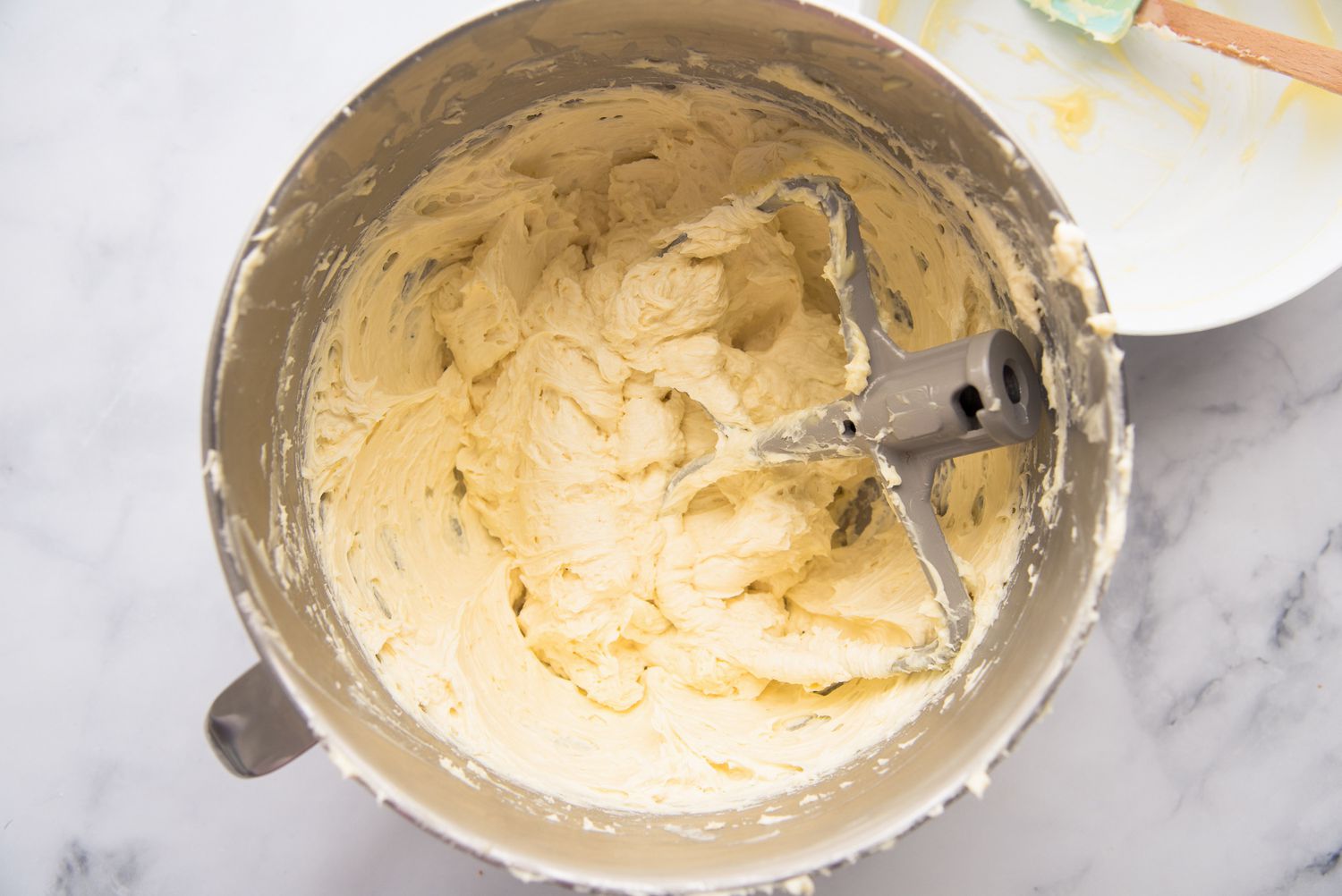 German buttercream in a mixer bowl.