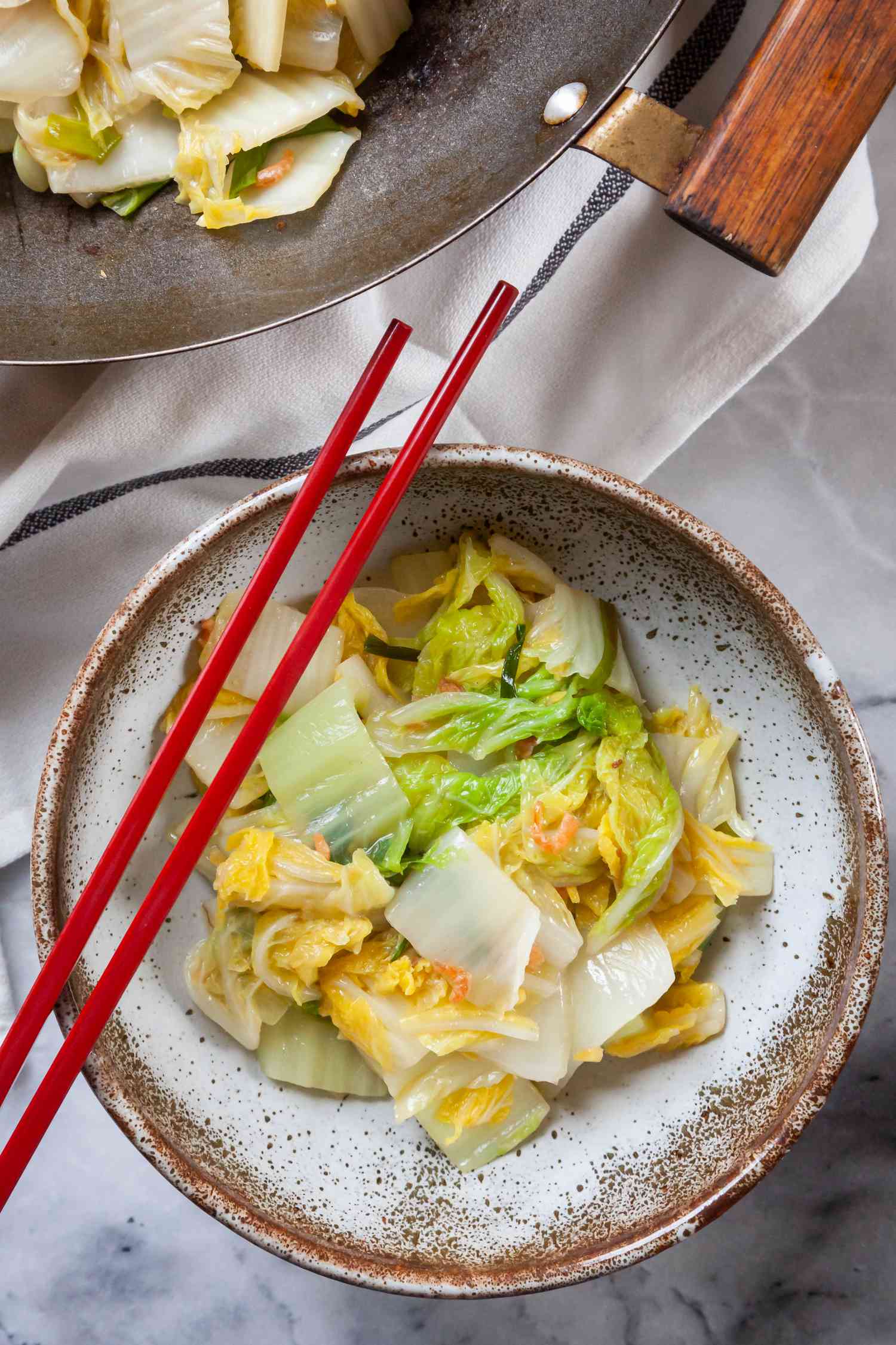 Napa Cabbage with Dried Shrimp in a bowl with chopsticks.