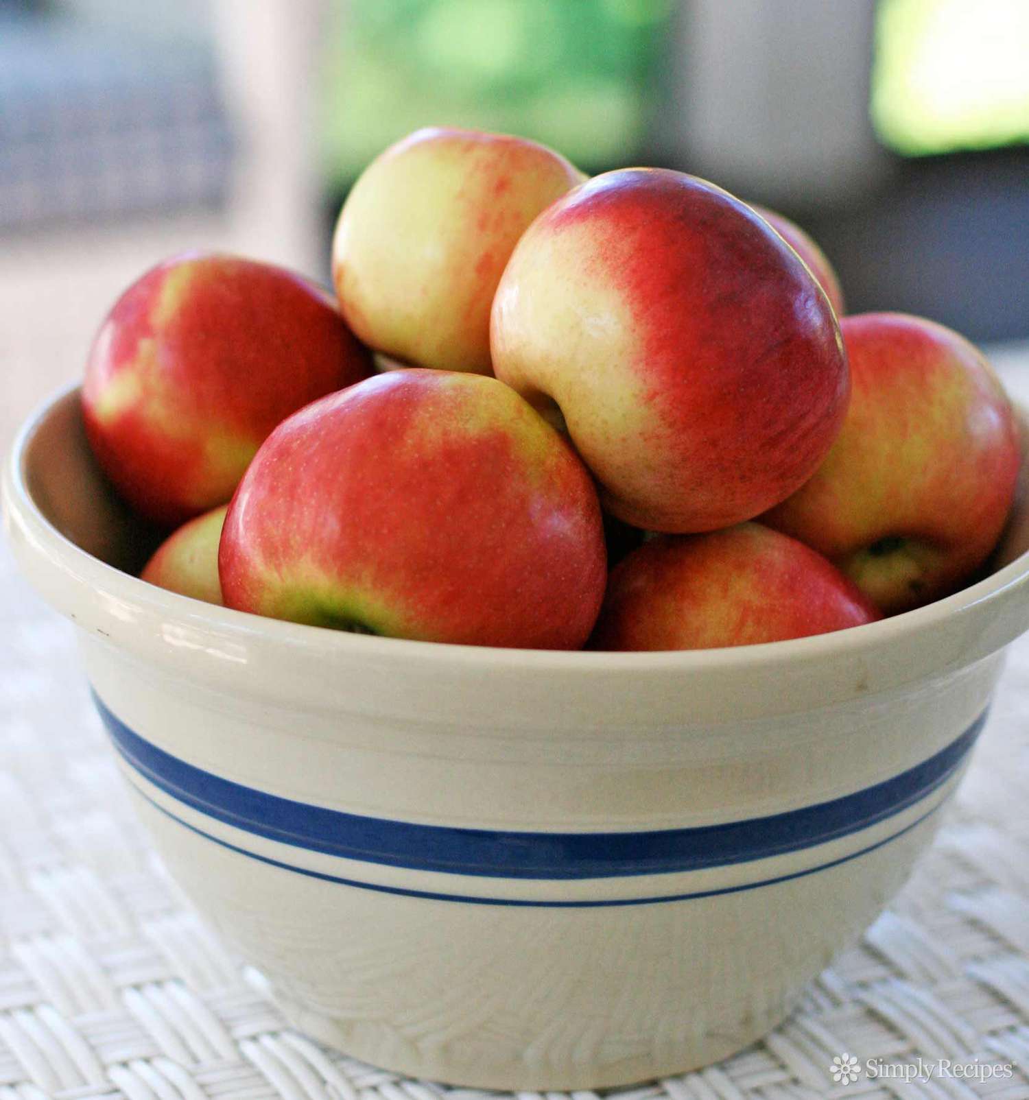 A large bowl full of Rome Beauty Apples