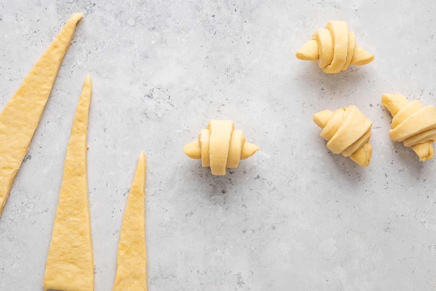 Homemade Crescent Rolls Next to Dough Triangles
