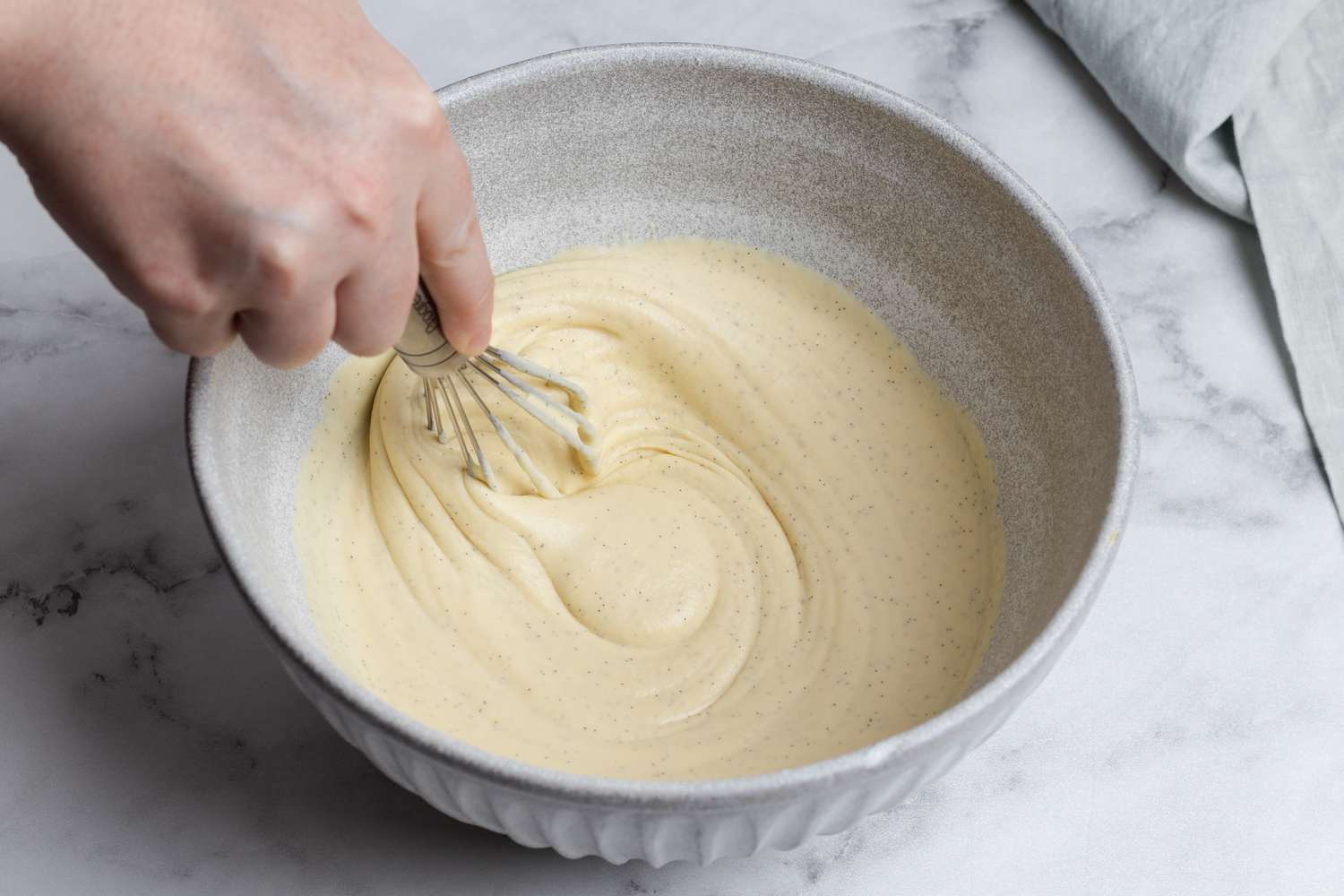 Whisking the custard base for a vanilla ice cream recipe.