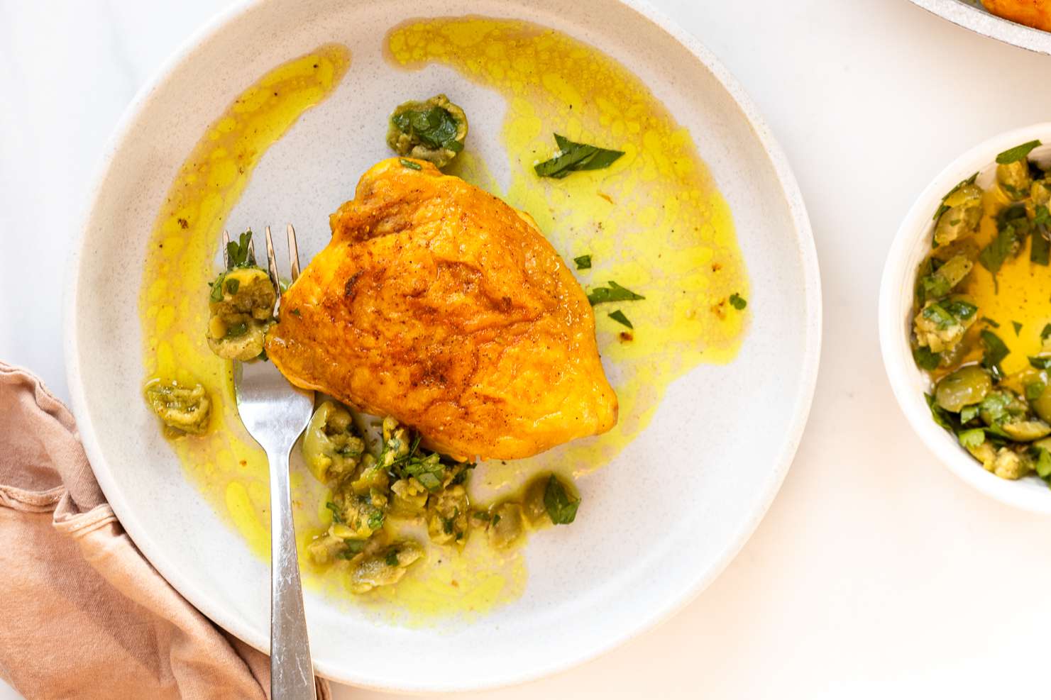 overhead view of a plate of Alison Roman's Vinegar Chicken