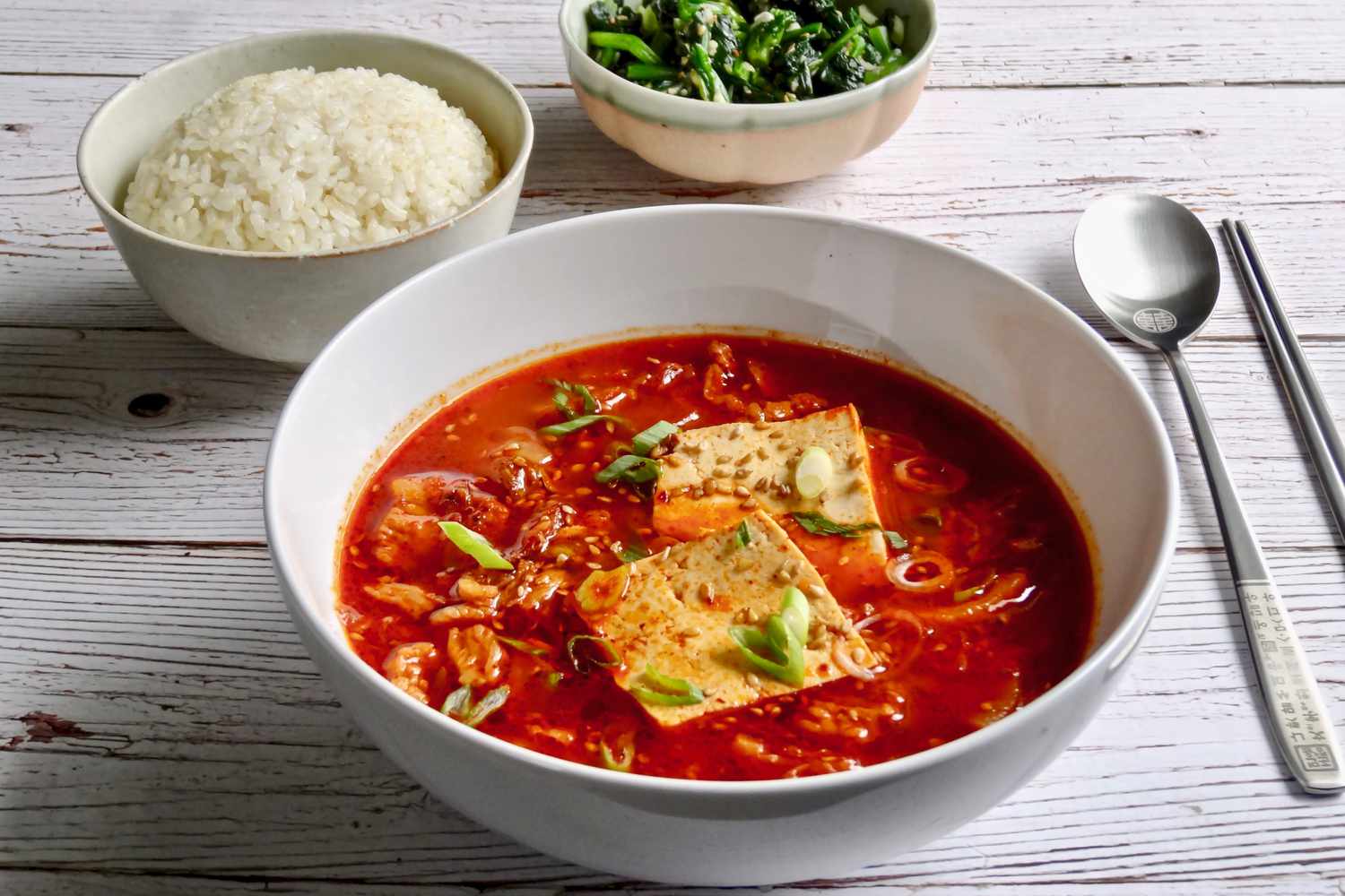 A bowl of Korean kimchi and pork belly stew.
