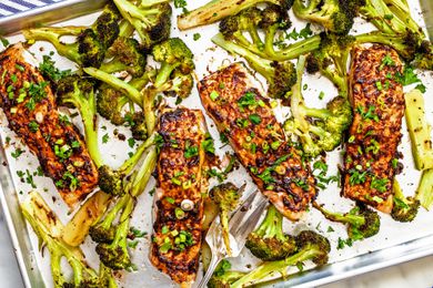 Miso butter roasted salmon and broccoli on a sheet tray