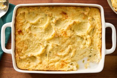 overhead view of Mashed Potato Casserole in a dish with one serving scooped out