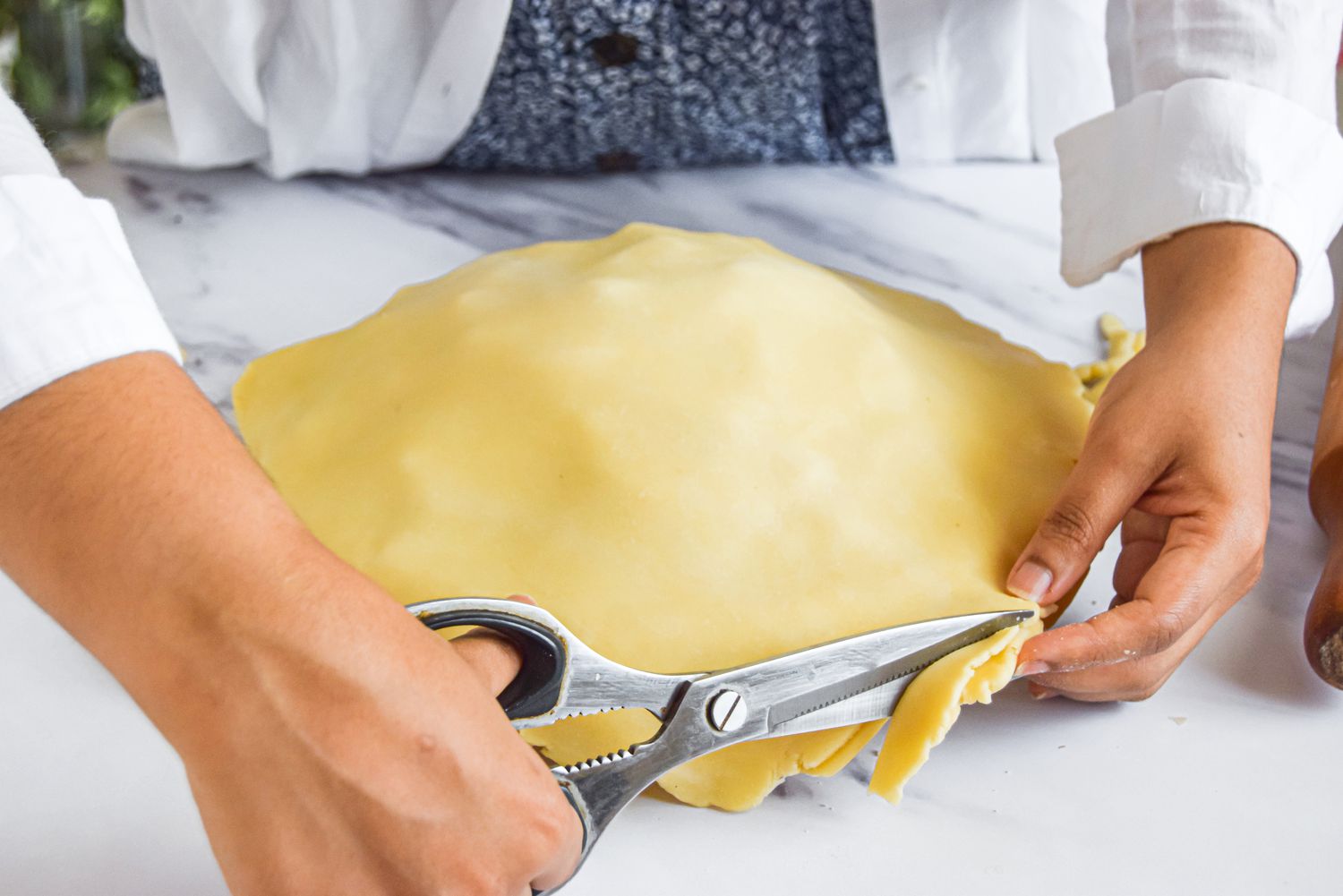 Excess Dough from Homemade Apple Pie Cut Using Scissors 