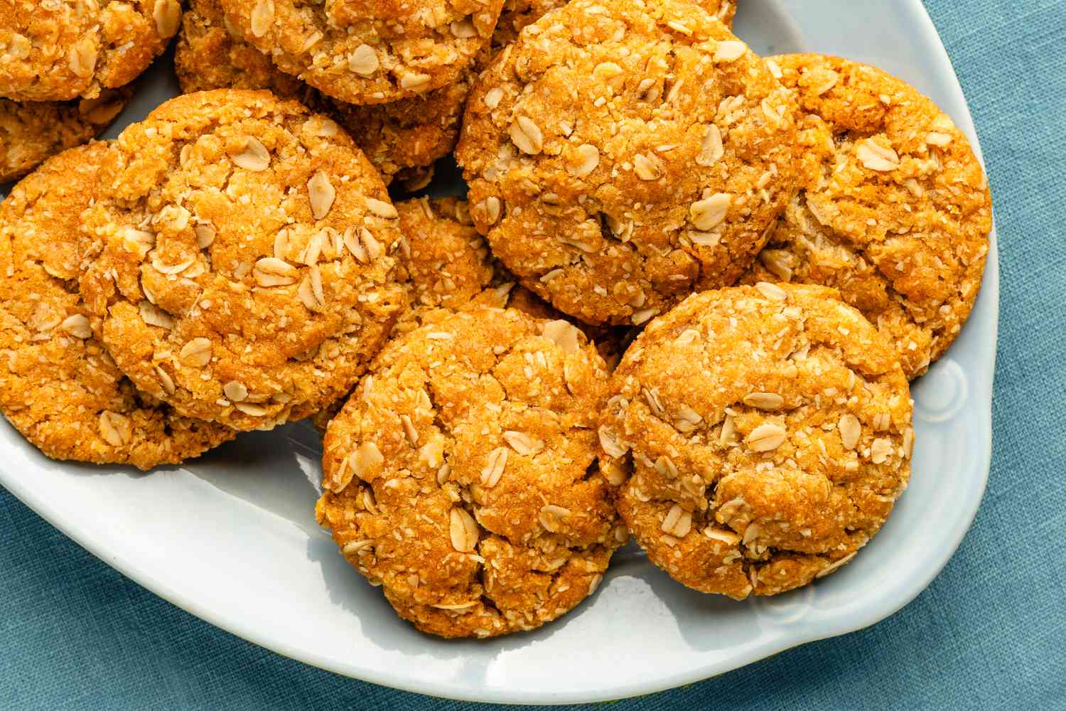 anzac biscuits on a light blue serving plate