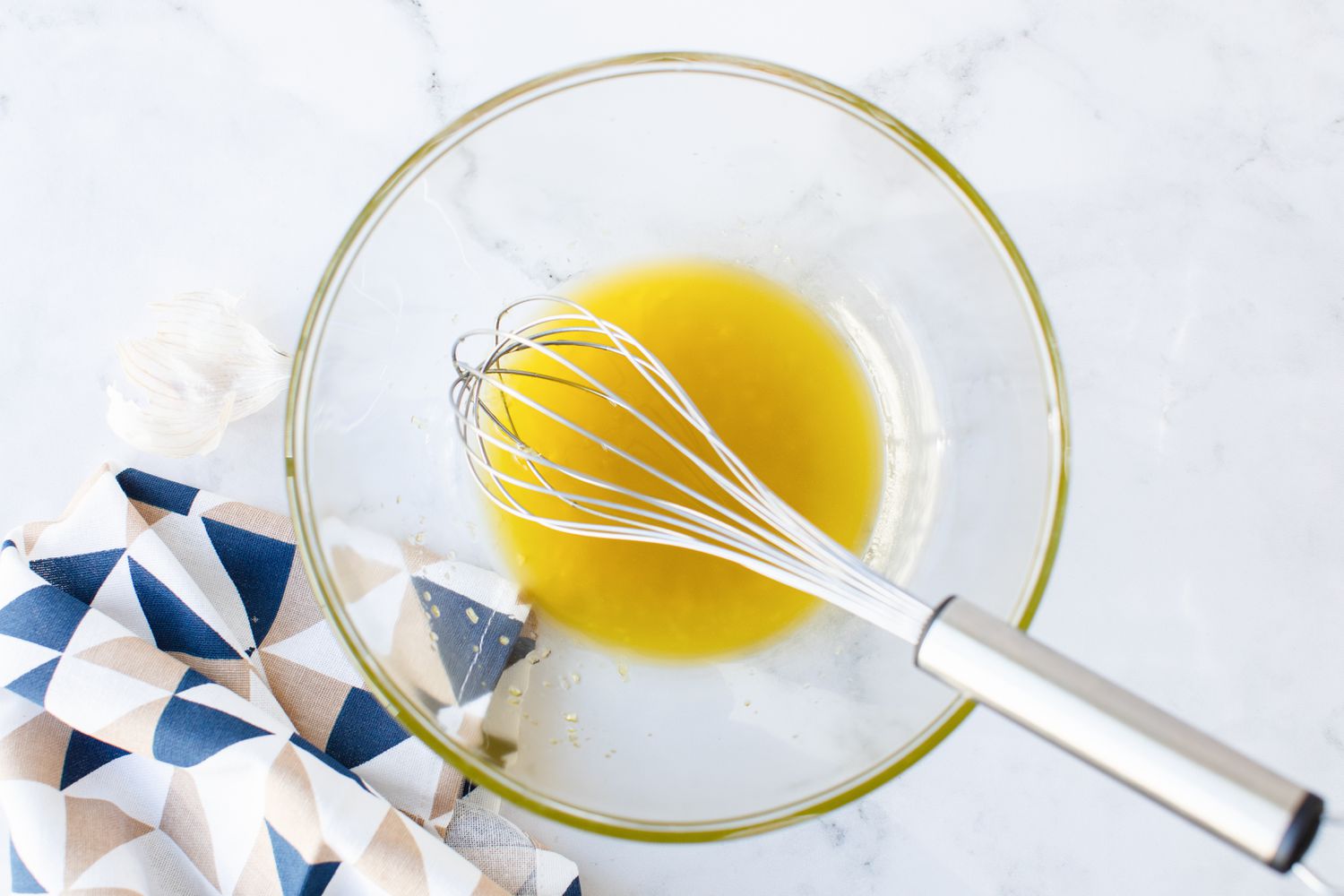Bowl of Olive Oil and Garlic for Classic Caesar Salad Recipe
