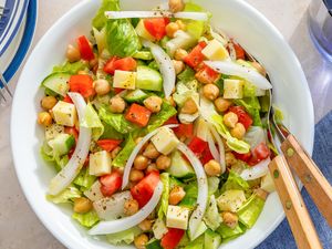 Bowl of Sicilian chopped salad with utensils on the side