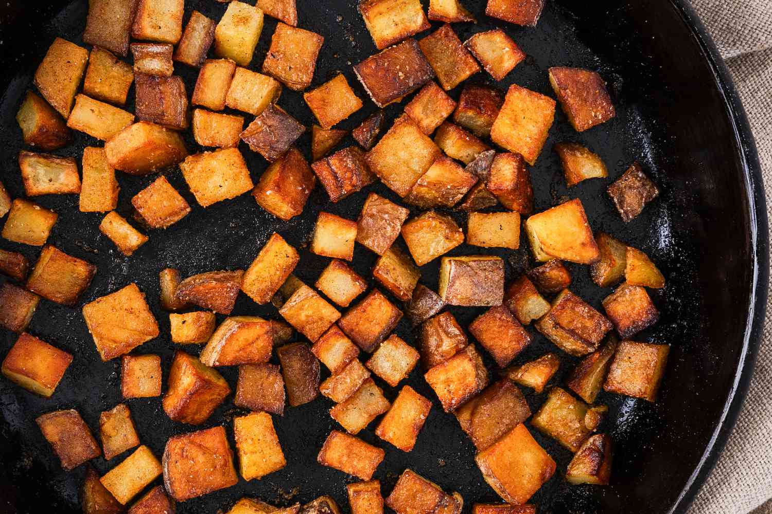 Dinner Style Breakfast Potatoes in a cast iron skillet from above