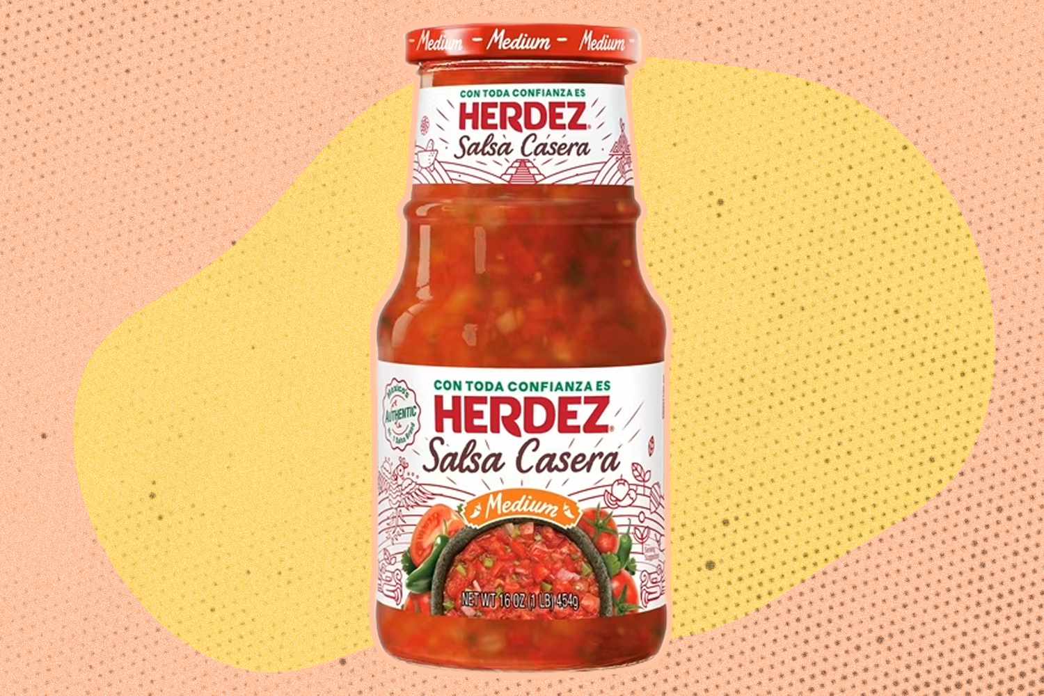 Herdez salsa jar in front of a yellow and peach background