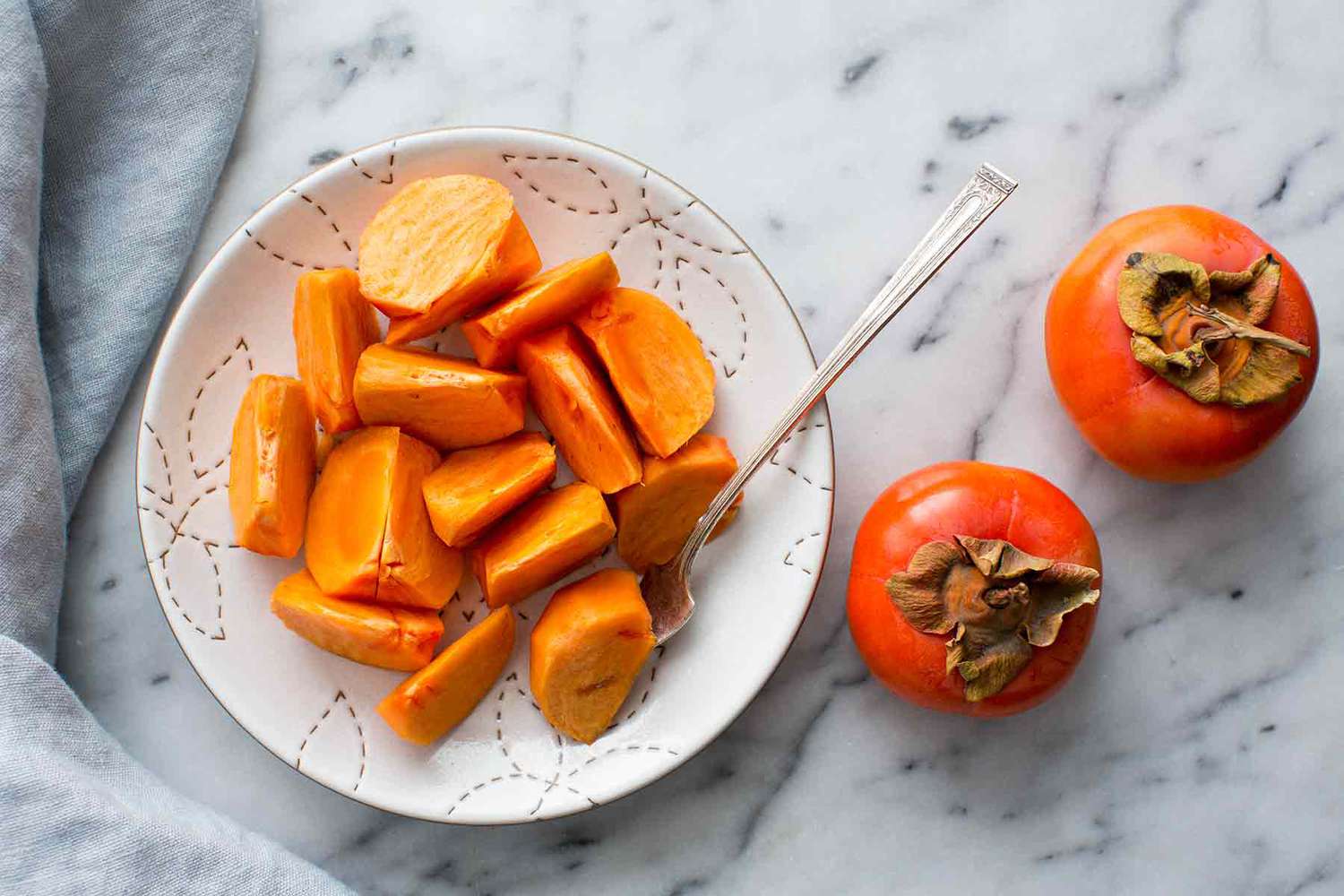 Eat Fuyu Persimmons like an apple, peel and slice them