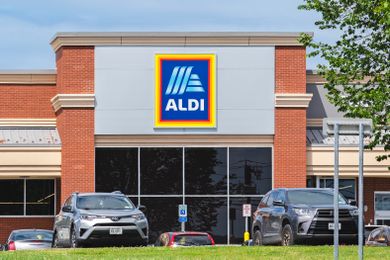 Exterior of an Aldi store with its logo prominently displayed on the building