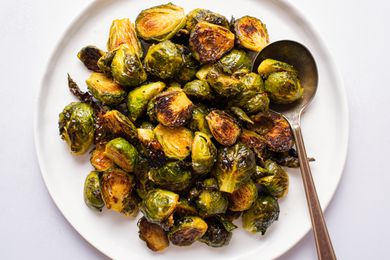 Honey mustard roasted Brussels sprouts on a white serving plate