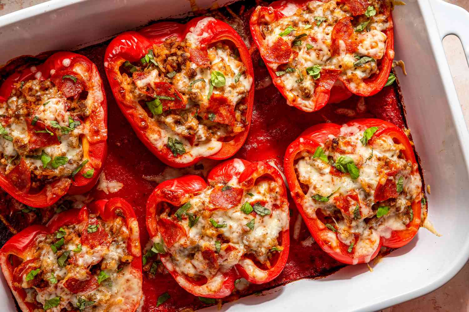 pizza stuffed peppers in a casserole dish