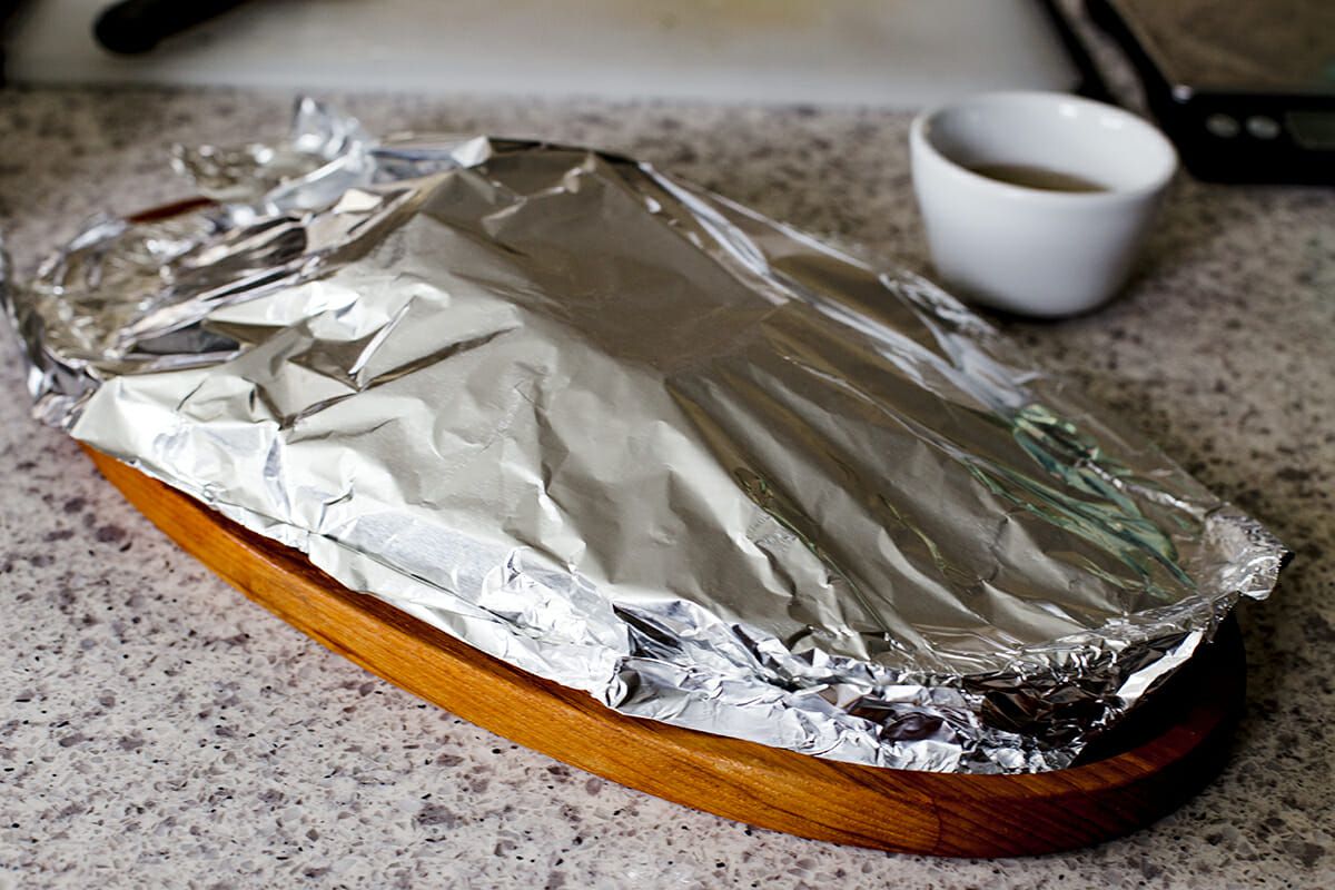 Insta Pot Corned Beef - corned beef on platter with aluminum foil