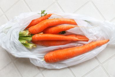 Carrots in a white plastic bag