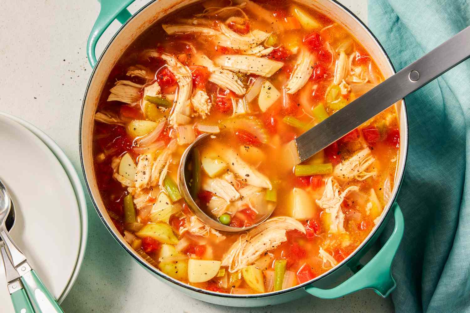 Chicken Vegetable Soup in a pot with a ladle