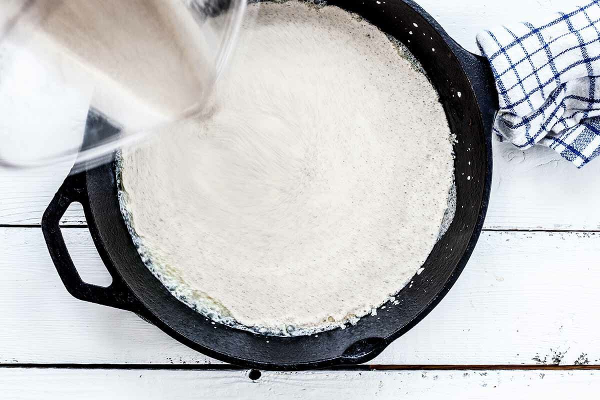 Puffy Dutch Baby Pancake Recipe with Buckwheat Flour pour the batter