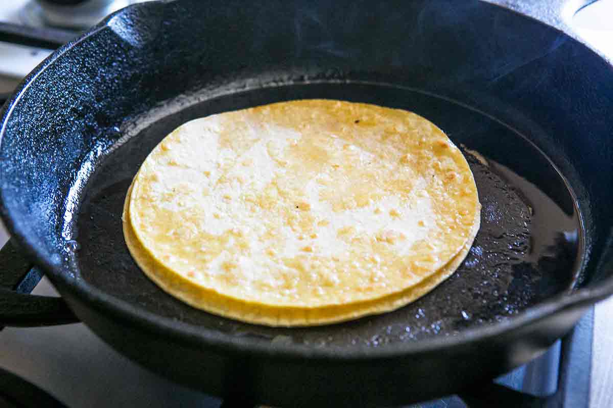 stack tortillas to absorb excess fat for making enchiladas