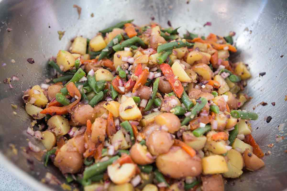 Mediterranean potato salad mixed in a bowl