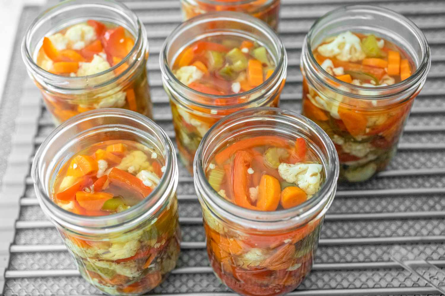 Jars of Giardiniera Cooling on a Counter