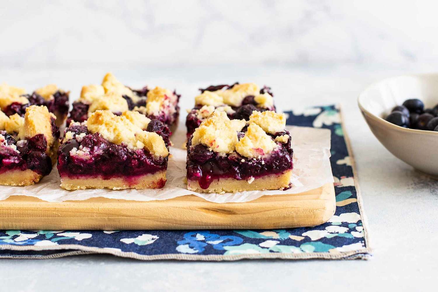 Crumb Bars with Blueberries cut the bars