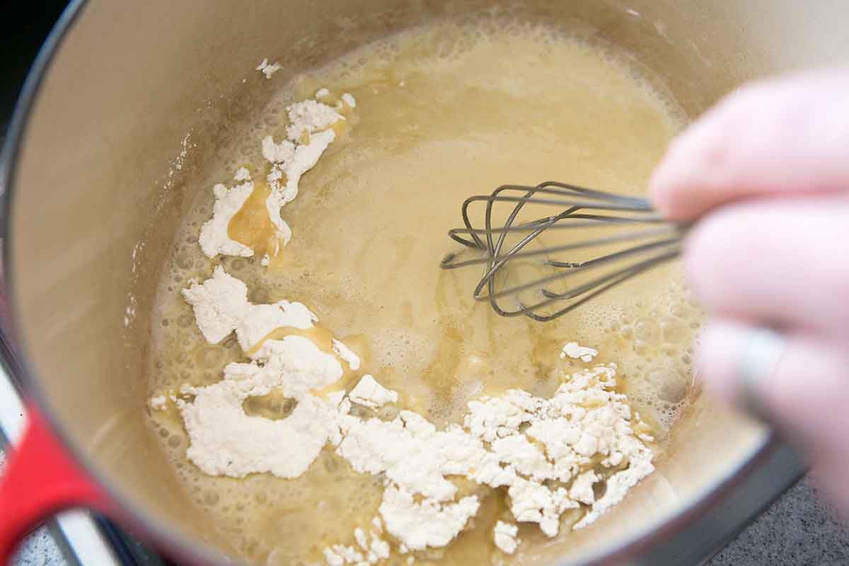 Start the roux for Cajun shrimp gumbo by whisking together flour and oil