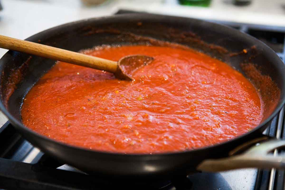 Make the tomato sauce for cooking homemade italian meatballs