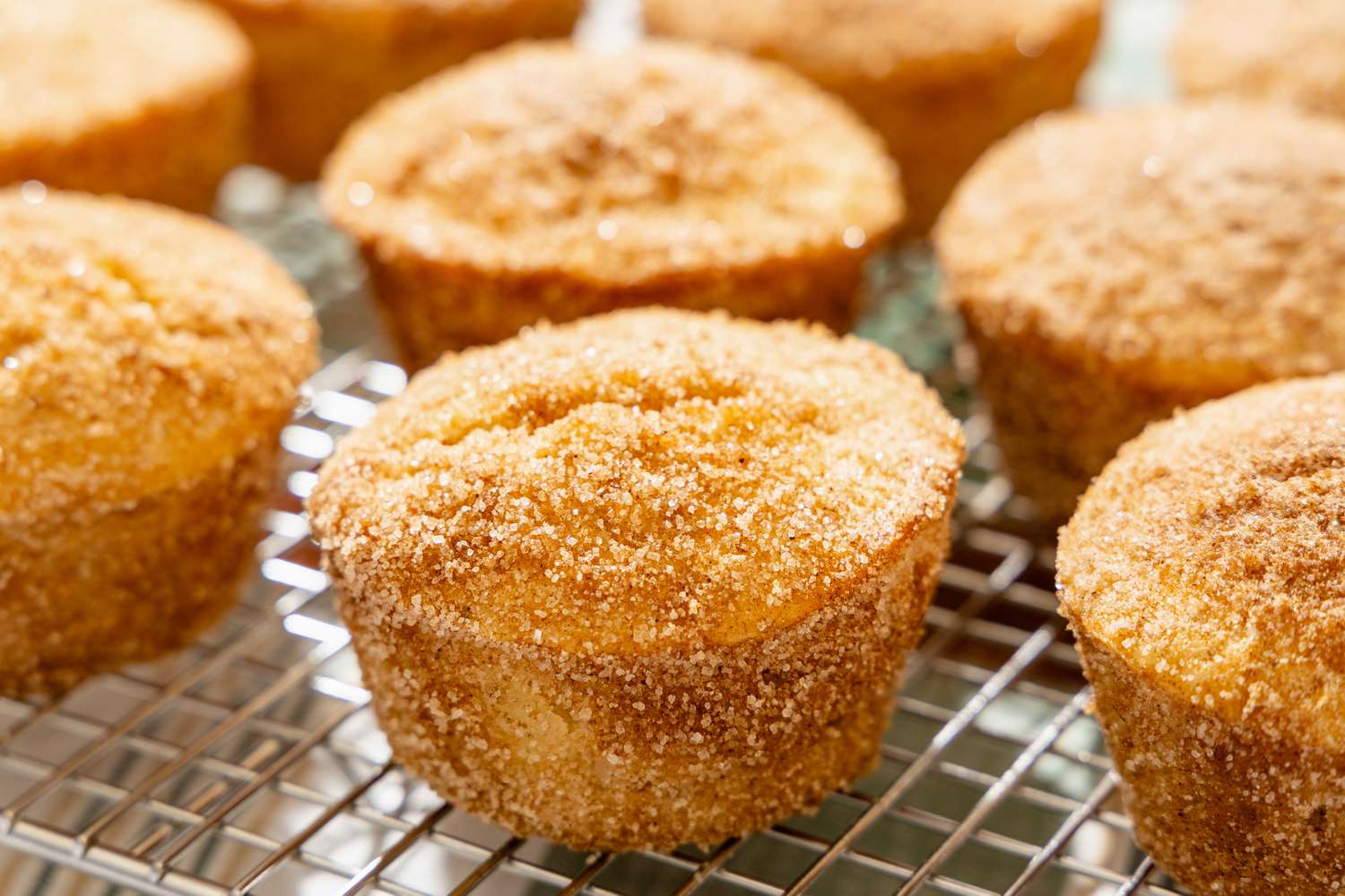 close up of Old-Fashioned Donut Muffins on a cooling rack