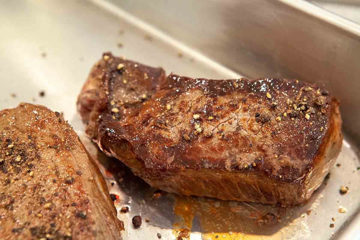 steaks sprinkled with peppercorns