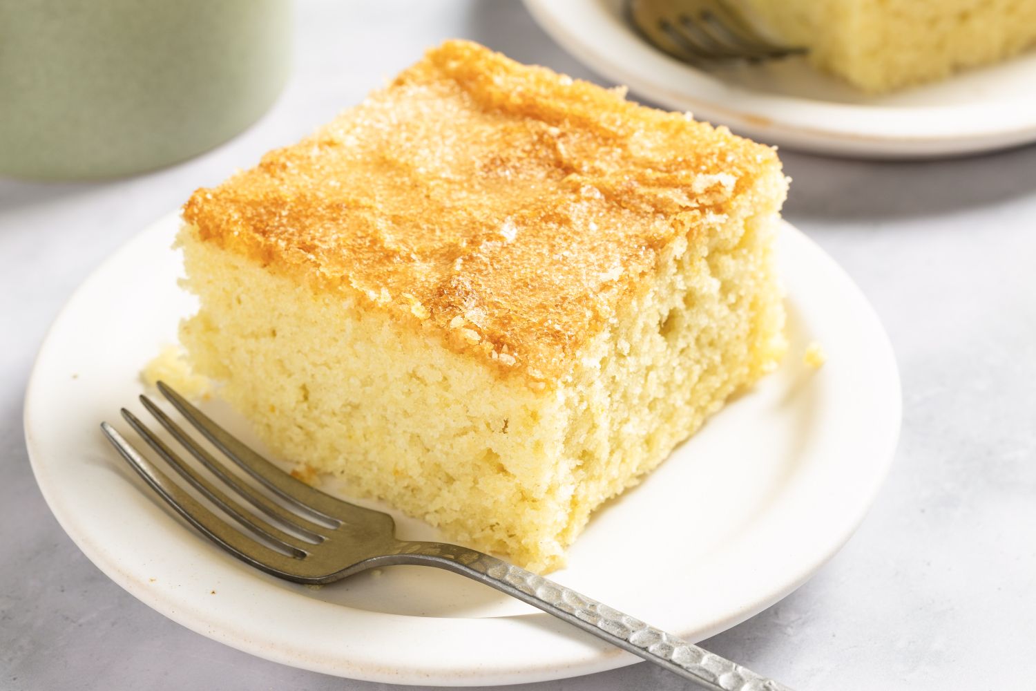 Slice of coca de llanda dessert on a plate with a fork