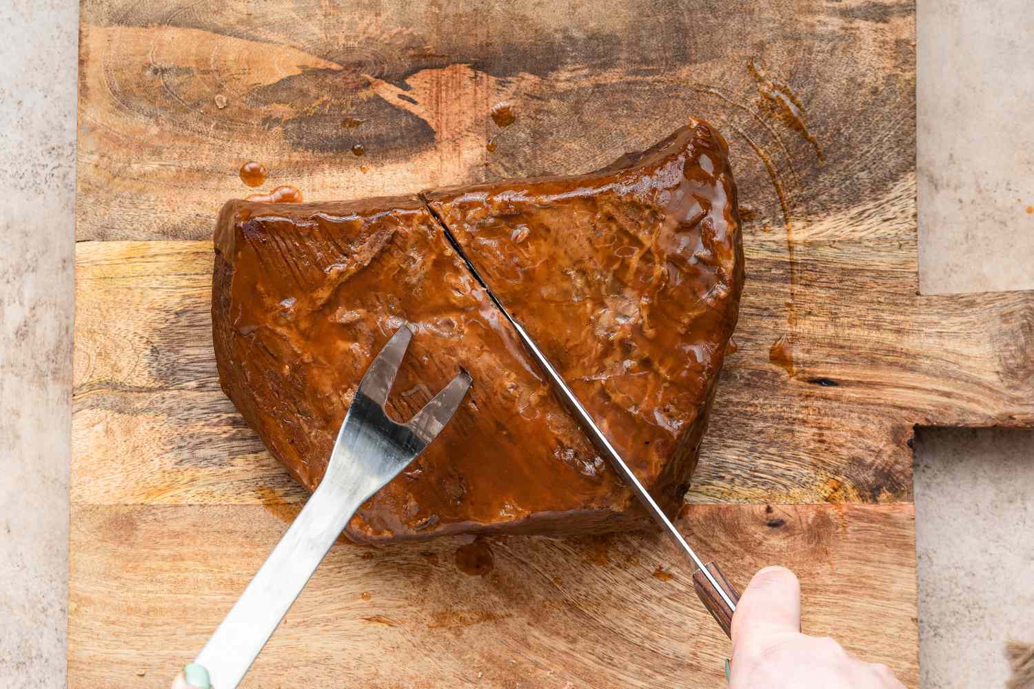 Cooked baked beef brisket on a carving board