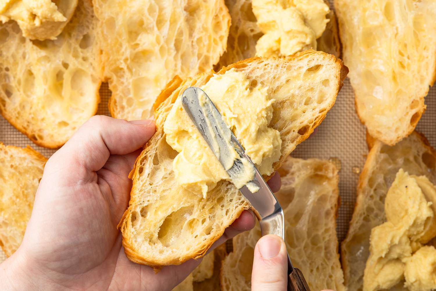 Frangipane Spread Onto the Bottom Half of the Croissant Using an Offset Spatula