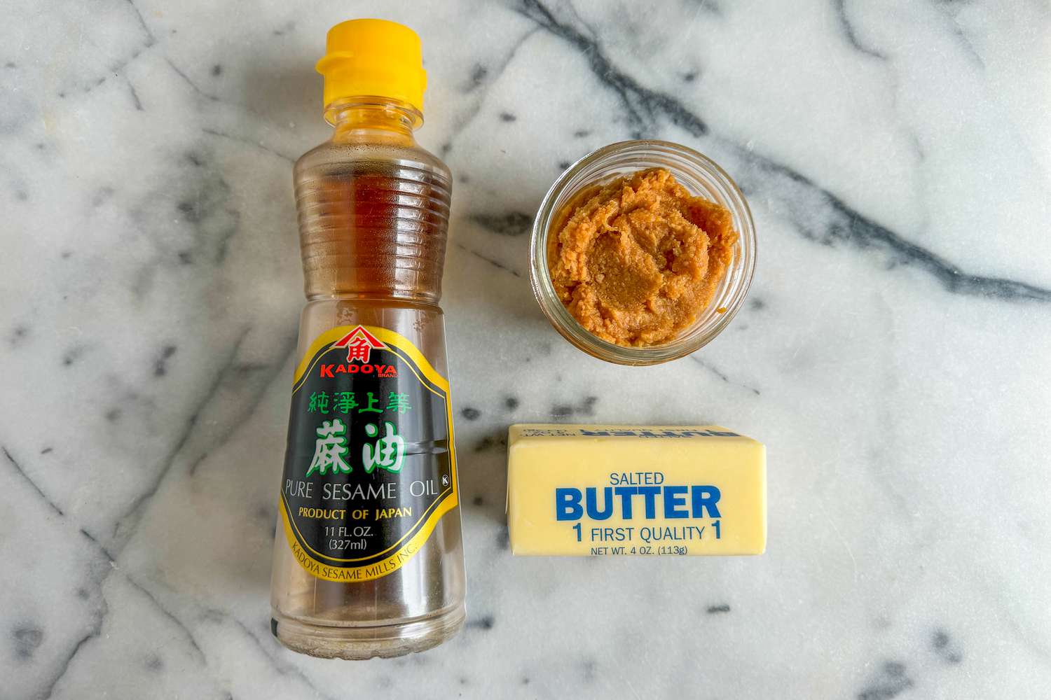 bowl of miso, stick of butter, and sesame oil