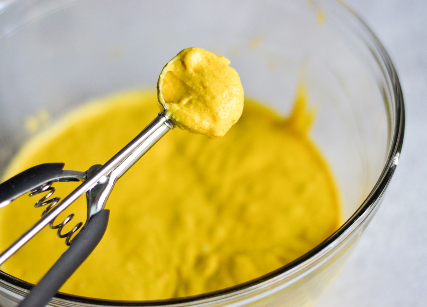 Scoop out the pholourie batter using a tablespoon-size cookie scoop 